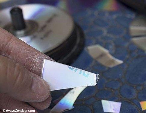 تزئین وسایل قدیمی با تکه های شکسته DVD 
